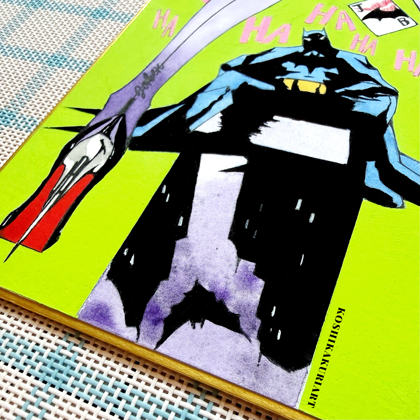 Close-up of "Red Sole" Batman Joker watercolor painting showing Daniel Smith mineral granulation on gold-edged Japanese Shikishi board.