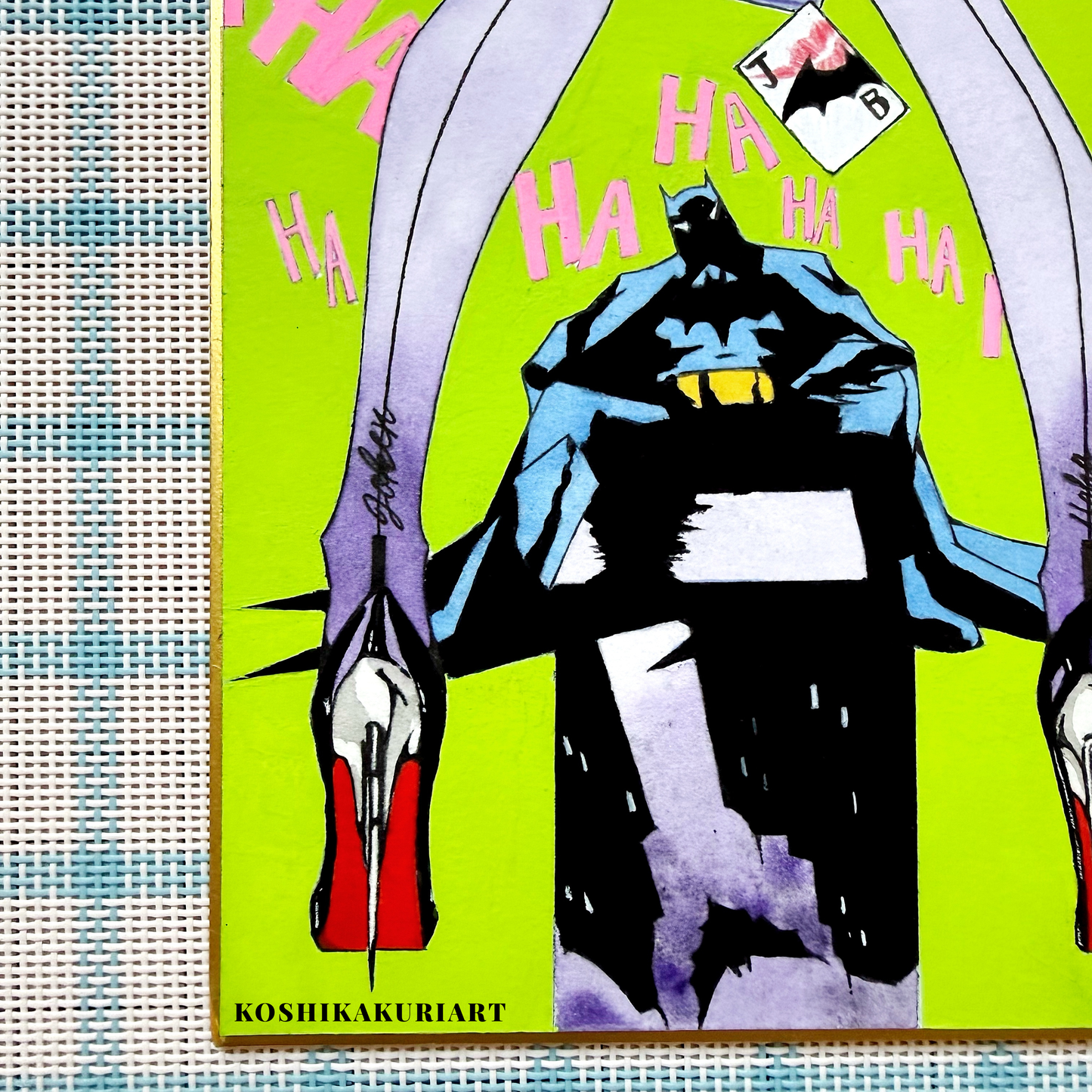 Close-up of "Red Sole" Batman Joker watercolor painting showing Daniel Smith mineral granulation on gold-edged Japanese Shikishi board.